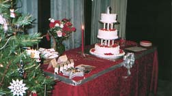 [The cake table, decorated with wedding
	colors]